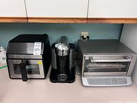 Front view of all three appliances side by side on counter
