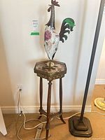 Full view of table and rooster sculpture