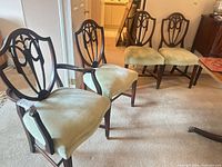 Four Hepplewhite chairs shown together