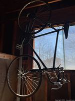 Full bicycle hanging upside down showing overall condition