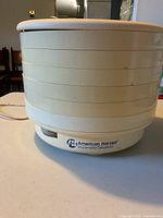 Exterior view of stacked dehydrator showing brand label