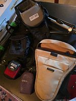 Overview of all camera cases, pouches and folded tripod