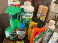 Group shot of assorted cleaning and gardening chemical containers