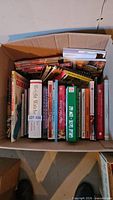 Overhead view of full box of cookbooks