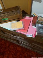 Tray, paper stacks, note cards and ribbon overview