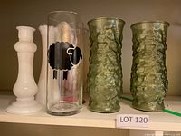 Group shot showing all six vases together on shelf