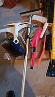 Group of assorted brushes and squeegees