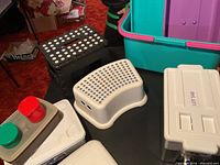 Group showing stools, organizer, food container, portion of tote