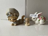 All three ceramic figurines side by side