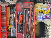 overview of toolbox and trays with assorted tools and rope