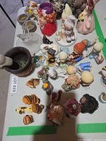 Overview of assorted figurines and trinkets on table