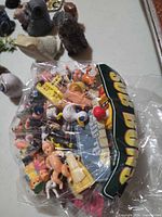 Plastic bag of mixed small plastic toys