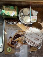 Group shot showing baking mat, cake decorator box, glass dish with molds and liners