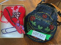 Both beaded purses side by side showing overall designs
