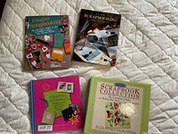 All four scrapbooking books laid out