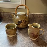 Three-piece ceramic set on countertop