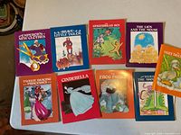 All nine book and record sets spread on table