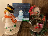 Group shot showing snowman lamp, light-up canvas and two tabletop mailboxes with decor