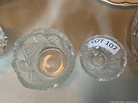 Round and square dishes; right dish with LOT 107 tag is part of lot