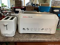 Sunbeam vertical grill next to KitchenWorks toaster showing overall condition