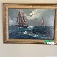 Full view of framed sailboat painting