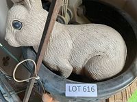 resin rabbit statue inside pot