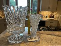 Both vases side by side with measuring tape showing height