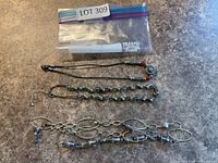 Overview of three necklaces on countertop