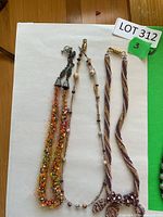 Three necklaces laid out for full view