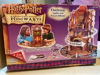 Front of Harry Potter Adventures Through Hogwarts electronic 3-D board game box