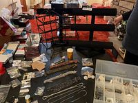 Overall view showing two display stands, organizer box and bulk jewelry findings