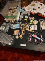 overview of table with assorted jewelry supplies in tote and on tabletop