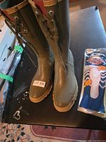 Full view of boots alongside packaged insoles