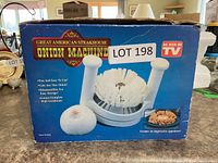 Retail box front displaying Great American Steakhouse Onion Machine, Lot 198 sticker visible