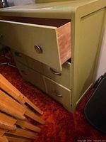 front view of dresser showing open top drawer and lower drawers