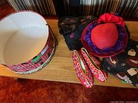 Overview showing hat box, hat, shoes and two tote bags