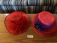 Both hats on table showing overall appearance