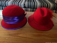 Both hats side by side on table showing overall styles
