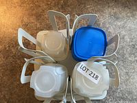 Top view showing rotating rack and six lidded Tupperware containers