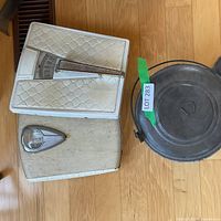 Two bathroom scales and metal pot with lid overview
