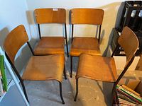 Four stacking chairs front view