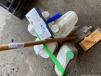 Grouped lot showing applicator box, pole, jugs, pad head