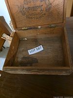 open view of wooden cigar box showing interior and wear