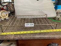Large stainless shelf rack with tape measure for scale