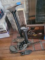 Overall lot showing cobbler stands, shoe lasts and Sad Iron