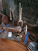 Full view of sewing machine with surrounding cobbler tools