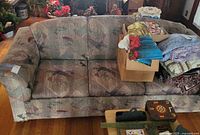 Front view of Bassett sofa showing overall style, upholstery pattern and seat configuration