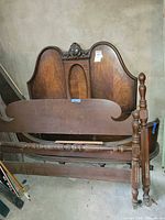 Both sets stacked showing headboard veneer panel and footboard with turned posts