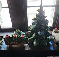 Tree and candle holder on windowsill