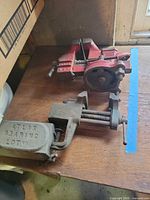 Cleveland red swivel vise and Atlas clamp vise on bench